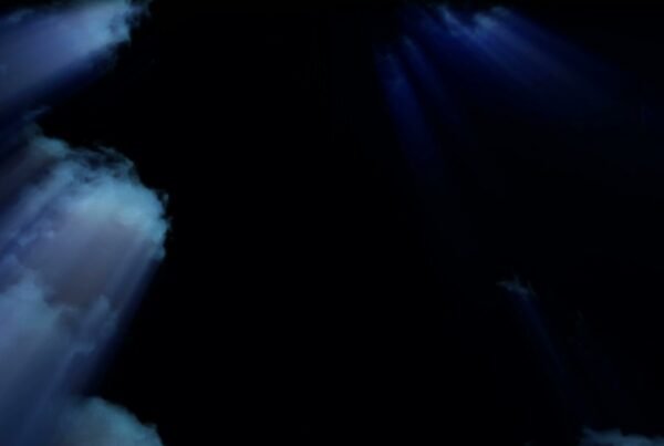 The video loop shows a dark scene, depicting a time-lapse night sky. Faint beams of light penetrate through misty clouds as they travel across the screen.